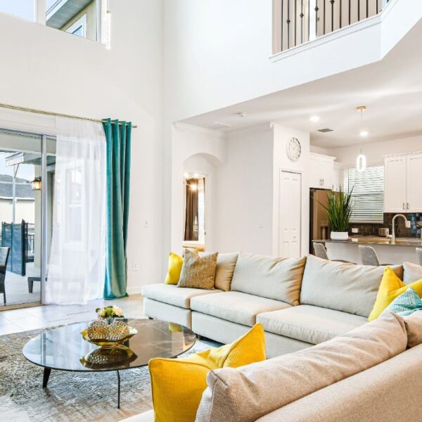 living room with kitchen in background